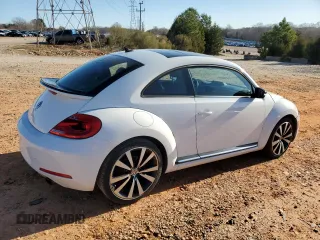 2012 Volkswagen Beetle 2.0T Turbo w/Sun/Snd/Nav PZEV with VIN 3VWVA7AT9CM656846, listed as a Copart auction lot 49466825 with 76,362 mi miles and Salvage Title. Bid and sale history available at carsss.com. Image 3.
