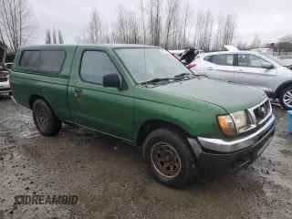 1998 Nissan Frontier XE with VIN 1N6DD21S4WC345165, listed as a Copart auction lot 87465104 with Not provided miles and Clean title. Bid and sale history available at DreamBid. Image 4.