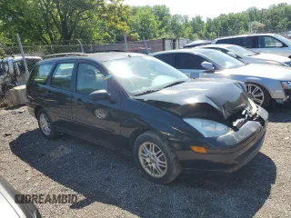 2004 Ford Focus ZTW with VIN 1FAFP35Z84W203676, listed as a Copart auction lot 57272835 with 183,115 mi miles and Salvage title. Bid and sale history available at DreamBid. Image 4.