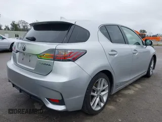 2014 Lexus CT 200h Hybrid with VIN JTHKD5BH0E2173721, listed as a IAAI auction lot 41798469 with 124,337 mi miles. Bid and sale history available at carsss.com. Image 4.