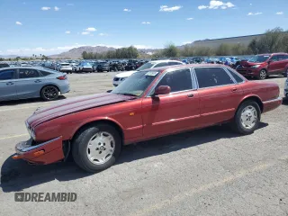 1995 Jaguar XJ with VIN SAJHX1747SC738538, listed as a Copart auction lot 52135635 with 149,283 mi miles and Salvage title. Bid and sale history available at DreamBid. Image 1.