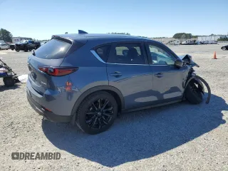2024 Mazda CX-5 2.5 S Carbon Edition with VIN JM3KFBCM7R0373655, listed as a Copart auction lot 48697675 with 21,680 mi miles and Salvage Title. Bid and sale history available at carsss.com. Image 3.