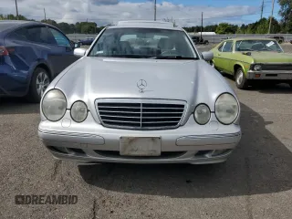 2001 Mercedes-Benz E-Class AWD with VIN WDBJF83J01X047817, listed as a Copart auction lot 71675084 with 143,127 mi miles and Salvage Title. Bid and sale history available at carsss.com. Image 5.