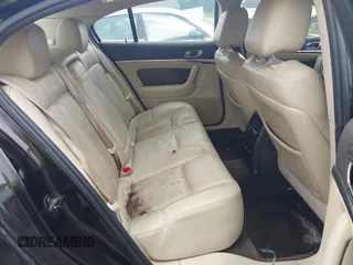 2013 Lincoln MKS z VIN 1LNHL9EK0DG600129, wystawiony jako IAAI lot #42314913 z przebiegiem 119 674 mil mil oraz . Historia ofert i sprzedaży dostępna na DreamBid. Obrazek 8.