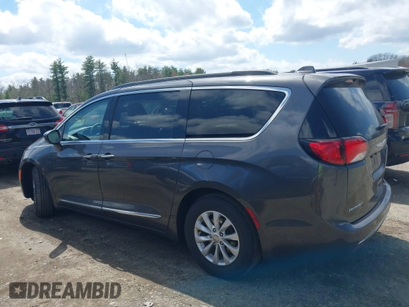 2017 Chrysler Pacifica Touring L with VIN 2C4RC1BGXHR667397, listed as a IAAI auction lot 42085117 with 63,996 mi miles and . Bid and sale history available at DreamBid. Image 14.