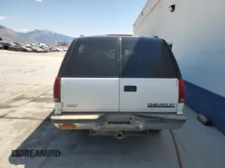 1999 Chevrolet Suburban with VIN 3GNFK16R4XG190883, listed as a Copart auction lot 58324415 with 228,782 mi miles and Salvage title. Bid and sale history available at DreamBid. Image 6.