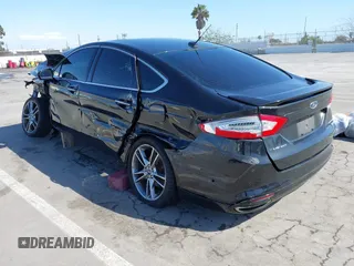 2014 Ford Fusion Titanium with VIN 3FA6P0K98ER163915, listed as a IAAI auction lot 41974577 with Not Provided miles. Bid and sale history available at carsss.com. Image 3.