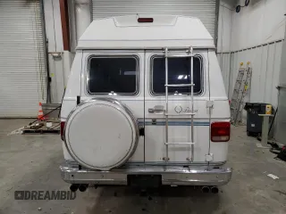 1990 GMC Vandura z VIN 1GDEG25K8L7521773, wystawiony jako Copart lot #84875104 z przebiegiem 171 457 mil mil oraz Tytuł czysty. Historia ofert i sprzedaży dostępna na DreamBid. Obrazek 6.