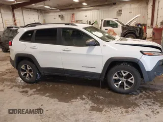 2014 Jeep Cherokee Trailhawk with VIN 1C4PJMBS5EW159912, listed as a IAAI auction lot 41538254 with 166,955 mi miles. Bid and sale history available at carsss.com. Image 13.