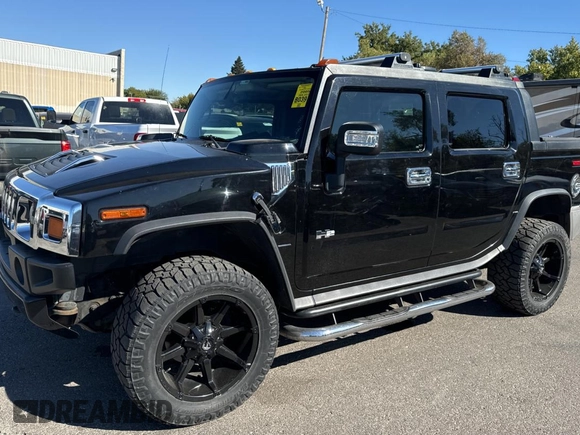 2005 Hummer H2 SUT with VIN 5GRGN22U35H113041, listed as a Copart auction lot 76730334 with 269,232 mi miles and Clean Title. Bid and sale history available at carsss.com. Image 2.