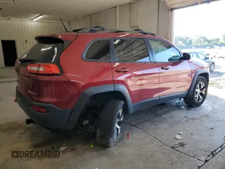 2015 Jeep Cherokee Trailhawk with VIN 1C4PJMBS1FW745928, listed as a Copart auction lot 62032585 with 132,559 mi miles and Salvage title. Bid and sale history available at DreamBid. Image 3.