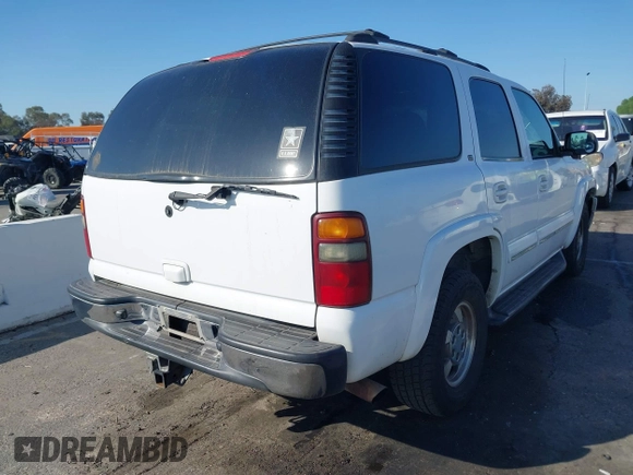 2002 Chevrolet Tahoe LS z VIN 1GNEC13TX2R240719, wystawiony jako IAAI lot #41616356 z przebiegiem 235 081 mil mil oraz . Historia ofert i sprzedaży dostępna na DreamBid. Obrazek 4.