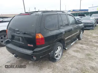 2006 GMC Envoy SLT with VIN 1GKDS13S462241866, listed as a IAAI auction lot 41943322 with 90,695 mi miles. Bid and sale history available at carsss.com. Image 4.