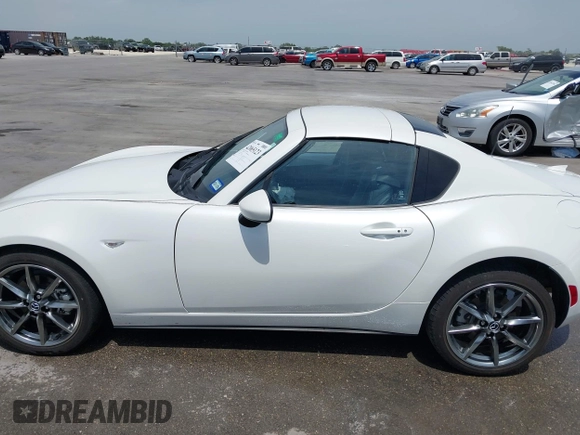 2023 Mazda MX-5 Miata Grand Touring с VIN JM1NDAM71P0560062, выставлен на аукционе IAAI как лот 42065123 с пробегом 11 320 миль миль и . История ставок и продаж доступна на DreamBid. Изображение 14.
