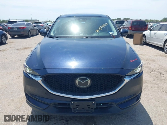 2018 Mazda CX-5 Touring z VIN JM3KFACM7J1410275, wystawiony jako IAAI lot #42248830 z przebiegiem 101 125 mil mil oraz . Historia ofert i sprzedaży dostępna na DreamBid. Obrazek 12.