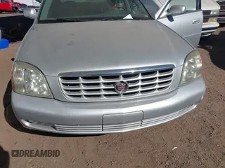 2003 Cadillac DeVille DTS z VIN 1G6KF57923U260229, wystawiony jako IAAI lot #41415468 z przebiegiem 58 012 mil mil oraz . Historia ofert i sprzedaży dostępna na DreamBid. Obrazek 6.