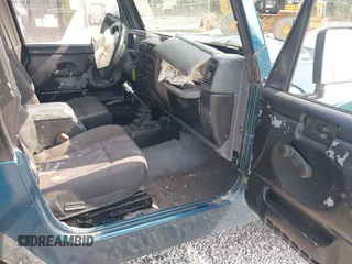1998 Jeep Wrangler Sport with VIN 1J4FY19S2WP786844, listed as a IAAI auction lot 42382789 with 306,228 mi miles and . Bid and sale history available at DreamBid. Image 5.