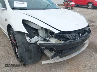 2019 Tesla Model 3 Mid Range with VIN 5YJ3E1EA8KF472540, listed as a IAAI auction lot 41661312 with 75,575 mi miles and . Bid and sale history available at DreamBid. Image 6.