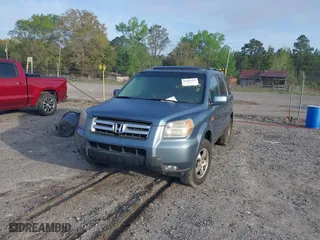 2006 Honda Pilot EX-L with VIN 5FNYF18516B002860, listed as a IAAI auction lot 41963343 with 202,799 mi miles. Bid and sale history available at carsss.com. Image 2.