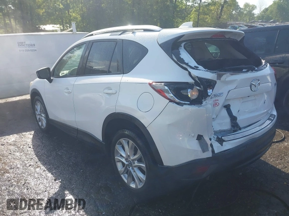 2014 Mazda CX-5 Grand Touring with VIN JM3KE2DY1E0424890, listed as a IAAI auction lot 42052437 with 107,793 mi miles. Bid and sale history available at carsss.com. Image 3.