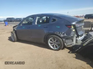 2023 Tesla Model Y Long Range z VIN 7SAYGDEE7PF965446, wystawiony jako Copart lot #54710375 z przebiegiem 23 807 mil mil oraz Szkoda całkowita • Salvage title. Historia ofert i sprzedaży dostępna na DreamBid. Obrazek 2.