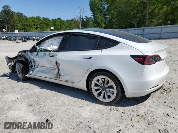 2023 Tesla Model 3 with VIN 5YJ3E1EA9PF558088, listed as a Copart auction lot 52228465 with 63,204 mi miles and Salvage title. Bid and sale history available at DreamBid. Image 2.