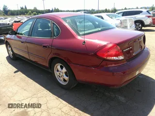 2005 Ford Taurus SE with VIN 1FAFP53U85A129306, listed as a IAAI auction lot 40585457 with 329,569 mi miles. Bid and sale history available at carsss.com. Image 3.