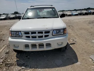 2001 Isuzu Rodeo S z VIN 4S2DM58W414330847, wystawiony jako Copart lot #64028134 z przebiegiem 160 027 mil mil oraz Tytuł czysty. Historia ofert i sprzedaży dostępna na DreamBid. Obrazek 5.