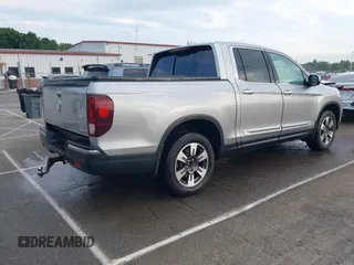 2019 Honda Ridgeline RTL-E with VIN 5FPYK3F72KB026100, listed as a IAAI auction lot 42205910 with 78,359 mi miles and . Bid and sale history available at DreamBid. Image 4.