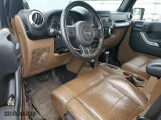 2011 Jeep Wrangler Unlimited Sahara with VIN 1J4BA5H16BL557068, listed as a Copart auction lot 80429454 with 142,428 mi miles and Salvage Title. Bid and sale history available at carsss.com. Image 8.