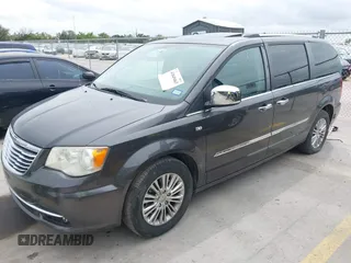2014 Chrysler Town & Country Touring L with VIN 2C4RC1CG7ER300693, listed as a IAAI auction lot 41849463 with 174,203 mi miles and . Bid and sale history available at carsss.com. Image 2.