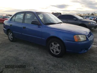 2000 Hyundai Accent z VIN KMHCG45GXYU125691, wystawiony jako Copart lot #87253294 z przebiegiem 91 062 mil mil oraz Szkoda całkowita • Salvage title. Historia ofert i sprzedaży dostępna na DreamBid. Obrazek 4.