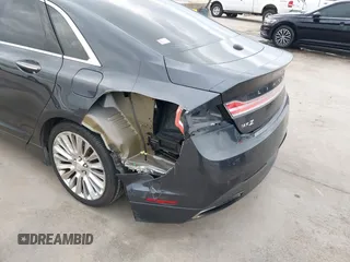 2014 Lincoln MKZ z VIN 3LN6L2G98ER830388, wystawiony jako IAAI lot #42104116 z przebiegiem 108 219 mil mil oraz . Historia ofert i sprzedaży dostępna na DreamBid. Obrazek 6.