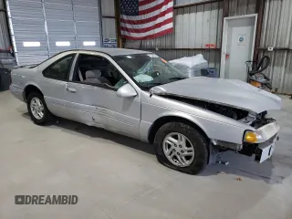 1997 Ford Thunderbird LX z VIN 1FALP62W1VH123205, wystawiony jako Copart lot #76107654 z przebiegiem 120 225 mil mil oraz Szkoda całkowita • Salvage title. Historia ofert i sprzedaży dostępna na DreamBid. Obrazek 4.