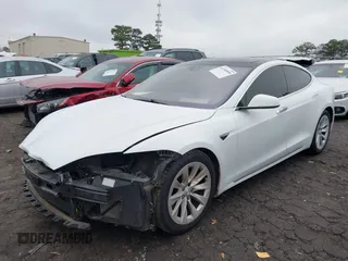 2016 Tesla Model S 90D with VIN 5YJSA1E26GF155962, listed as a IAAI auction lot 41348998 with 134,269 mi miles and . Bid and sale history available at DreamBid. Image 2.