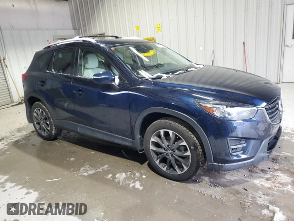 2016 Mazda CX-5 Grand Touring with VIN JM3KE4DY9G0708024, listed as a Copart auction lot 44689995 with 113,002 mi miles and Salvage Title. Bid and sale history available at DreamBid. Image 4.