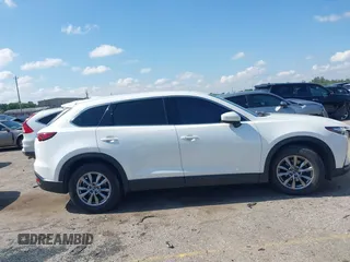 2019 Mazda CX-9 Touring with VIN JM3TCACY7K0314539, listed as a IAAI auction lot 42234361 with 98,299 mi miles and . Bid and sale history available at DreamBid. Image 13.