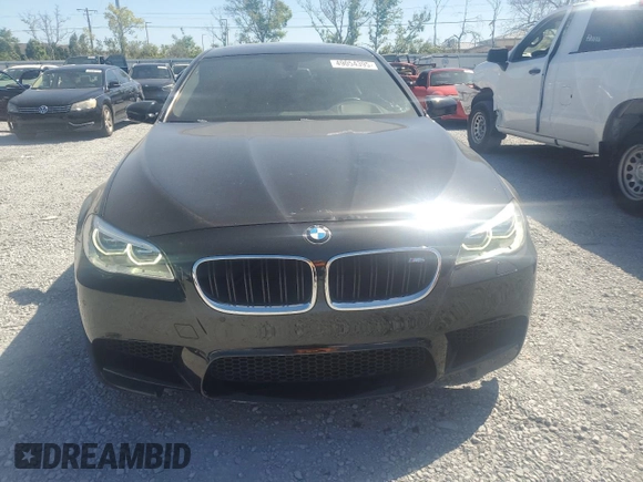 2014 BMW M5 z VIN WBSFV9C52ED593005, wystawiony jako Copart lot #49054395 z przebiegiem 71 213 mil mil oraz Szkoda całkowita • Salvage title. Historia ofert i sprzedaży dostępna na DreamBid. Obrazek 5.