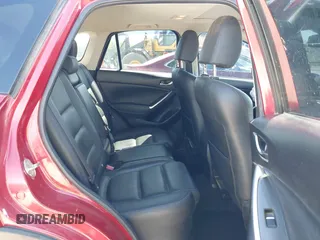 2016 Mazda CX-5 Grand Touring with VIN JM3KE2DYXG0652017, listed as a IAAI auction lot 42041158 with 95,946 mi miles and . Bid and sale history available at DreamBid. Image 8.