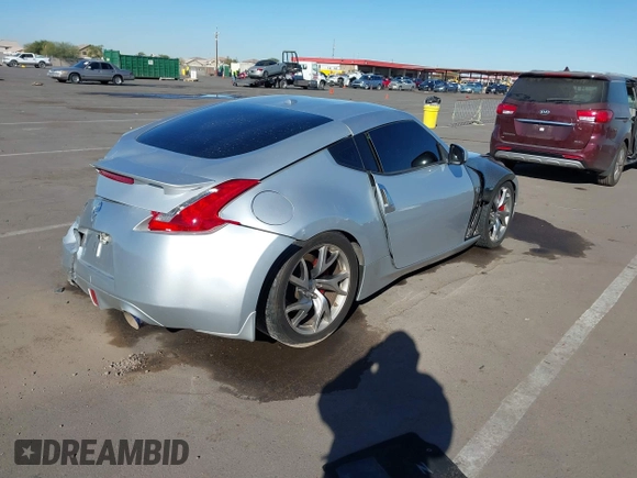 2014 Nissan 370Z Nismo with VIN JN1AZ4EHXEM634418, listed as a IAAI auction lot 41308580 with 84,074 mi miles and . Bid and sale history available at DreamBid. Image 4.
