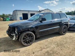 2018 Jeep Grand Cherokee Laredo E with VIN 1C4RJFAGXJC287415, listed as a Copart auction lot 64182975 with 103,817 mi miles and Salvage title. Bid and sale history available at DreamBid. Image 1.