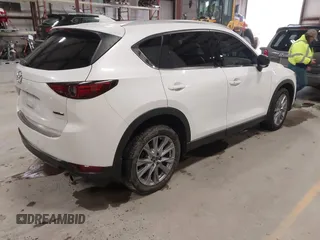 2020 Mazda CX-5 Grand Touring with VIN JM3KFBDM6L1828611, listed as a IAAI auction lot 42006976 with 59,939 mi miles and . Bid and sale history available at DreamBid. Image 4.