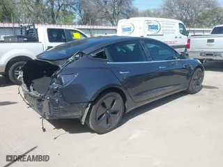 2018 Tesla Model 3 Long Range Battery with VIN 5YJ3E1EA4JF157782, listed as a IAAI auction lot 41774169 with 123,239 mi miles. Bid and sale history available at carsss.com. Image 4.