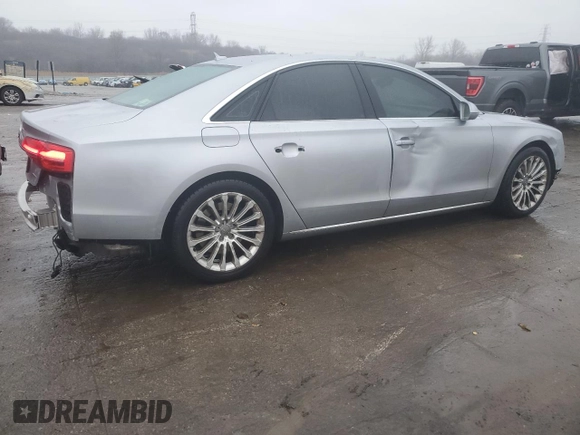 2015 Audi A8 z VIN WAUJGAFD0FN010021, wystawiony jako Copart lot #86861684 z przebiegiem 112 697 mil mil oraz Szkoda całkowita • Salvage title. Historia ofert i sprzedaży dostępna na DreamBid. Obrazek 3.
