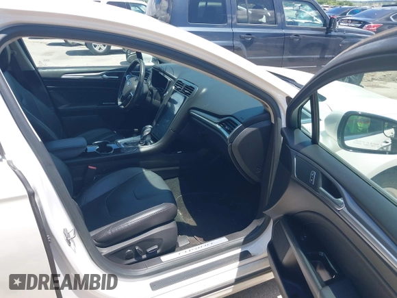2016 Ford Fusion Titanium with VIN 3FA6P0SU5GR120687, listed as a IAAI auction lot 42571006 with 143,210 mi miles and . Bid and sale history available at DreamBid. Image 5.