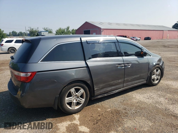 2012 Honda Odyssey Touring with VIN 5FNRL5H90CB505590, listed as a Copart auction lot 62566715 with 323,092 mi miles and Clean title. Bid and sale history available at DreamBid. Image 3.