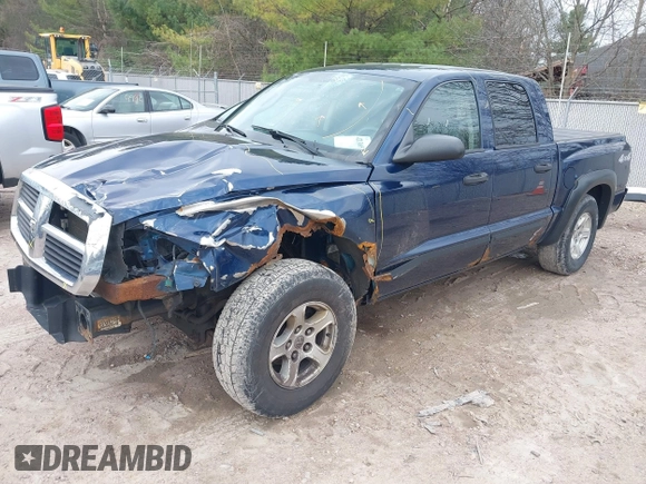 2005 Dodge Dakota SLT with VIN 1D7HW48N65S288584, listed as a IAAI auction lot 42130695 with 221,636 mi miles. Bid and sale history available at carsss.com. Image 2.