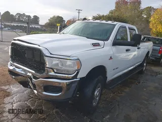 2021 Ram 2500 Tradesman with VIN 3C6UR5HL0MG648241, listed as a IAAI auction lot 40782479 with 57,033 mi miles and . Bid and sale history available at DreamBid. Image 2.