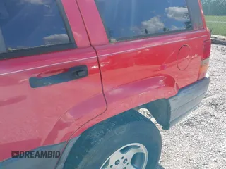1998 Jeep Grand Cherokee Laredo with VIN 1J4FX58S9WC137514, listed as a IAAI auction lot 42305247 with 228,669 mi miles and . Bid and sale history available at DreamBid. Image 6.