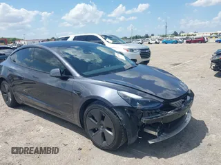 2023 Tesla Model 3 with VIN 5YJ3E1EAXPF575448, listed as a IAAI auction lot 42019288 with 33,859 mi miles. Bid and sale history available at carsss.com. Image 1.